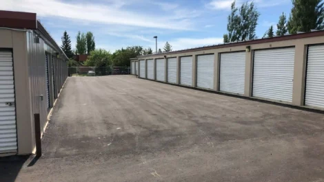 Storage facility with multiple units and a large paved area.