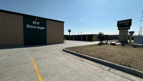 Storage facility with designated RV storage and clear access road.