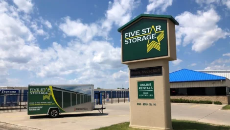Five Star Storage location with a sign and trailer for convenient storage rentals.