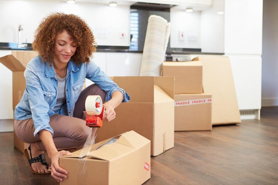 Woman using moving and packing supplies