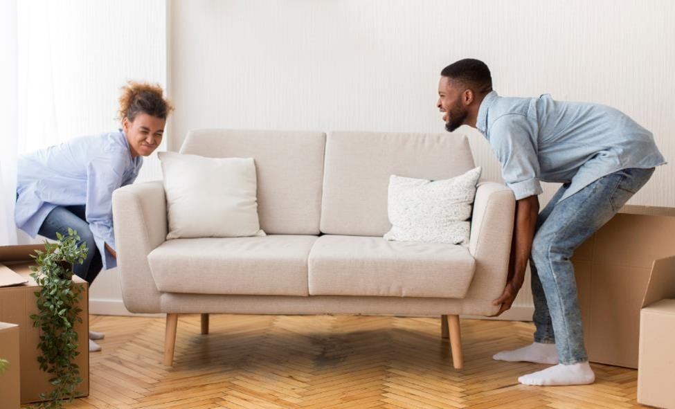 A couple moving their couch