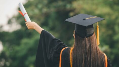 A woman and a diploma.