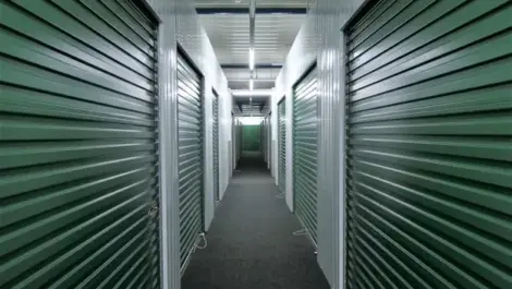 A row of dark green storage units