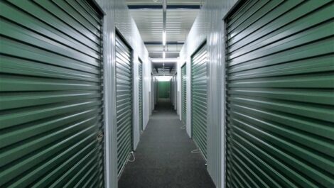 A row of dark green storage units