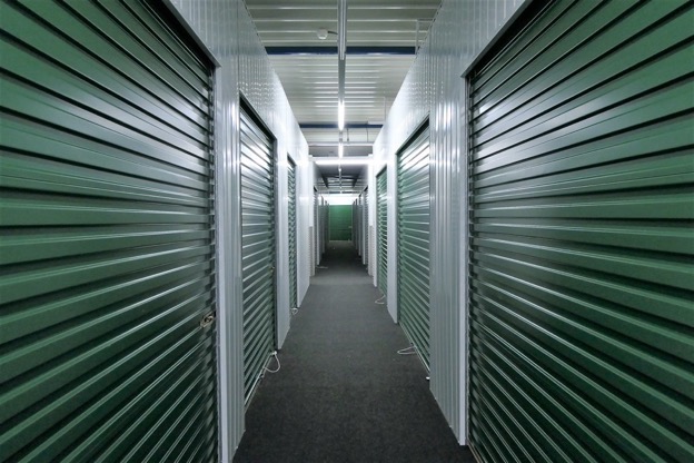 A row of dark green storage units.