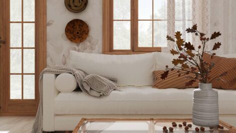 A sofa with light touches of fall accents throughout the room.