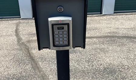 Security keypad on a post designed for secure access at a storage facility.