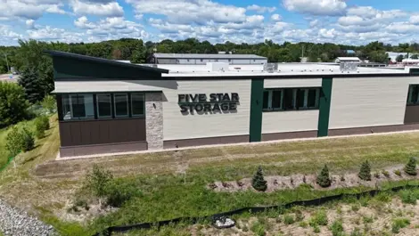 Exterior of Five Star Storage facility with brand signage and green landscaping.