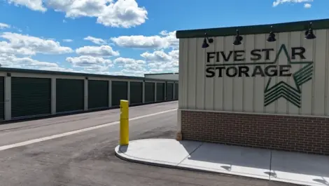 Five Star Storage building with clear brand logo and green storage units.