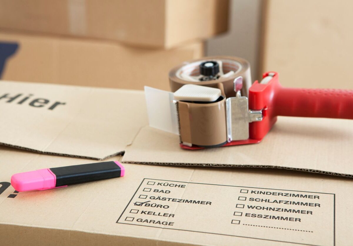 A couple of moving boxes with packaging tape.